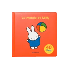 An orange Miffy book with at the center, Miffy playing with a beach ball in her blue dress and at the top the title "Le monde de miffy" written in orange
